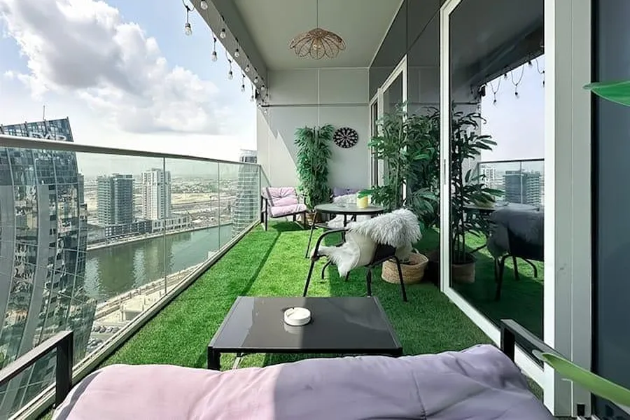 Balcony transformed with artificial grass