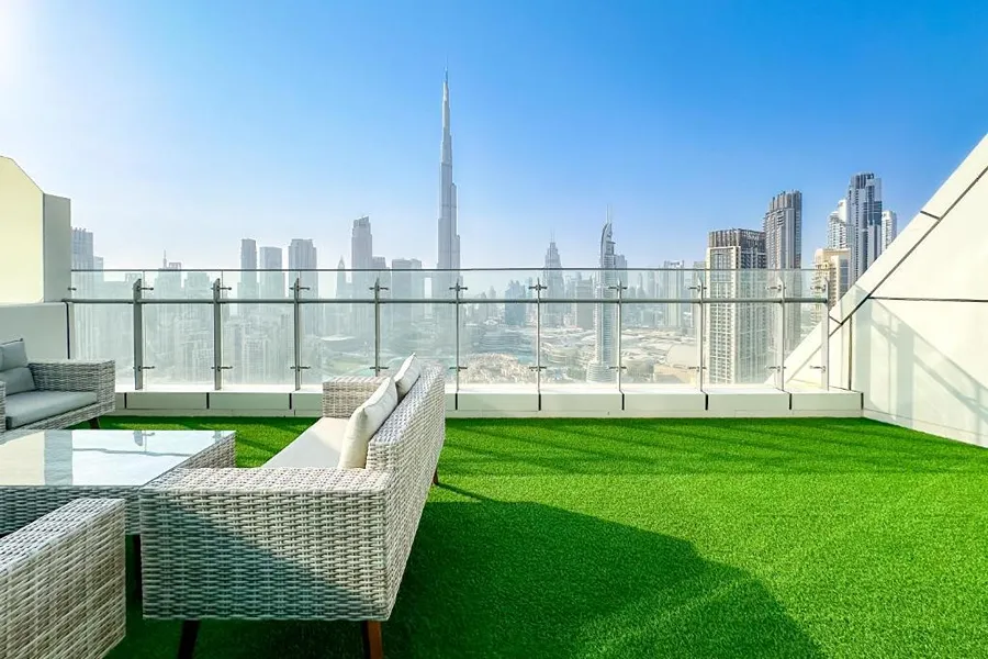 Balcony transformed with artificial grass